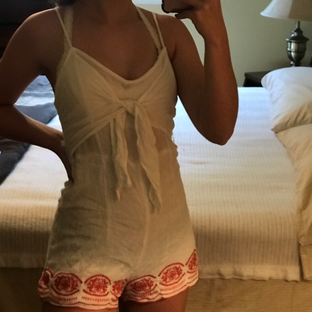 White romper with red design